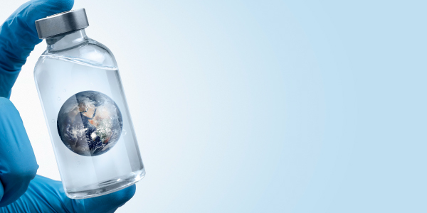 person-with-surgical-gloves-holding-earth-bottle_600L